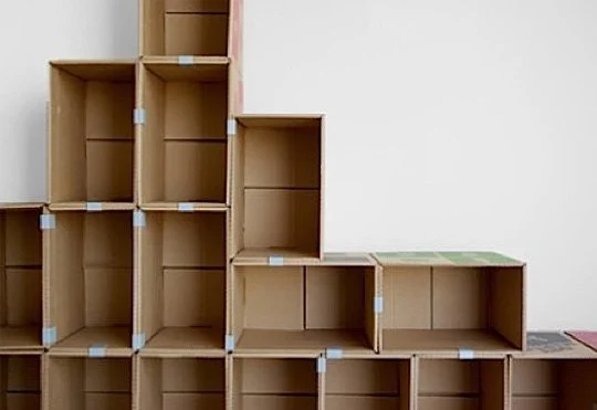 Shoe rack made from boxes.